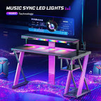 Scrivania da Gaming a L con Supporto Monitor, Presa di Corrente, Luce LED, Portabicchieri e Supporto Controller – 41.6'' / 57''