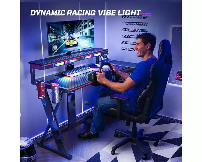 Scrivania da Gaming a L con Supporto Monitor, Presa di Corrente, Luce LED, Portabicchieri e Supporto Controller – 41.6'' / 57''