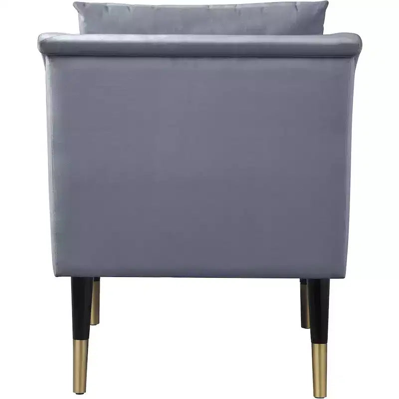 Poltrona in velluto con gambe in legno
