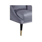 Poltrona in velluto con gambe in legno